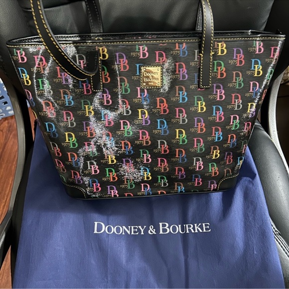 Dooney & Bourke Handbags - NWOT Dooney & Bourke Multi Nelly Tote & Dust Bag.
